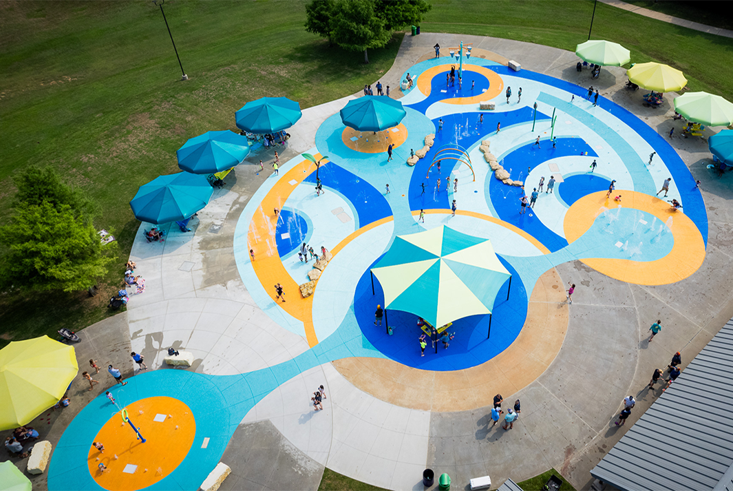 Kids playing at Lewisville, TX Old Town Aquatic Park Splash Park Design Build by Kraftsman